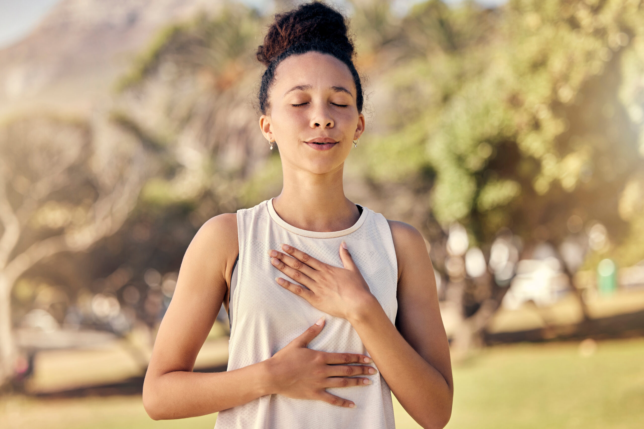 Fitness, woman and yoga breathing in relax for spiritual wellness, mental wellbeing or calm exercise in nature. Female relaxing, exercising and training in warm up breath activity for healthy workout